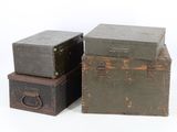 three boxes stacked on top of each other on a white surface