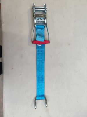a blue strap with a red buckle hanging on a wall