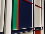 a wall that has many different colored squares on it