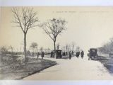 a black and white photo of people walking down a road