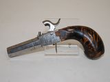 an old gun that is on display on a table