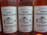 several bottles of wine are lined up on a table