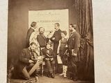 an old photo of a group of people posing for a picture