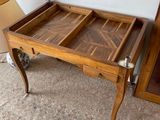 a wooden table with a drawer on top of it
