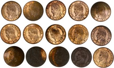 a close up of a bunch of coins on a white surface