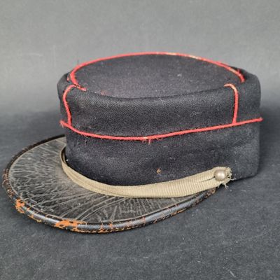 an image of a black hat with a red stitching on it