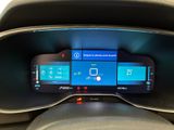 the dashboard of a car with a digital display on it