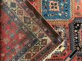 an image of a carpet with many different colors and patterns on it
