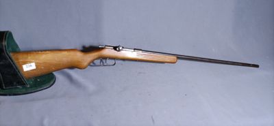 a rifle with a wooden barrel on a blue background