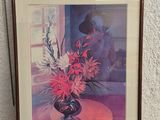 painting of a vase of flowers on a table in front of a white wall