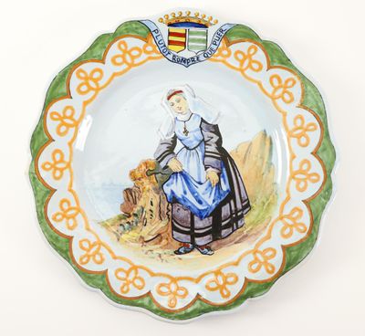 a plate with a picture of a woman and a dog on it