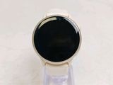 a smart watch sitting on a stand on a table