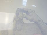 a drawing of a person holding a toy in their hand