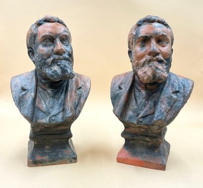 two busturines of two men with beards on each of them