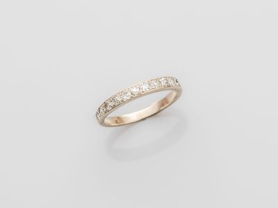 a white gold ring with diamonds on a white background