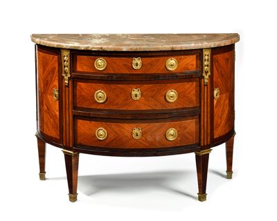 a small chest of drawers with marble top on a stand