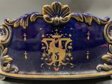 a blue and gold clock sitting on a table