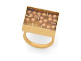 a close up of a gold plated ring with pearls in it