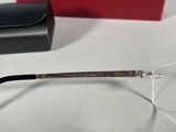 the glasses are made of metal and have a clear lens
