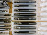 many different types of pens and pencils in the case