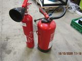 two fire extinguisors sitting on the floor next to each other