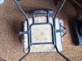 a chair that is sitting on the floor in front of a cabinet