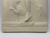 a sculpture of a man and a dog on a pedestal