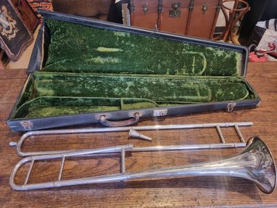a case with a trumpet inside of it on a table