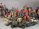a lot of figurines that are sitting on a table