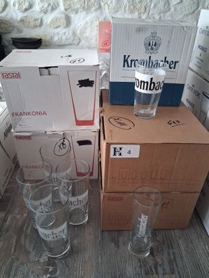 many boxes of beer and glasses on the table