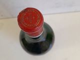 a bottle of wine that is sitting on a table