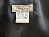 a close up of a label on the back of a jacket