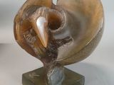 a sculpture of a shell with a bird ' s head on it