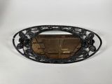 a mirror that is hanging on the wall in the room