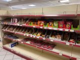 a lot of snacks on the shelves in the store