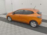 the orange car is parked in the garage on the checkered floor