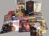 a lot of comic books sitting on a table