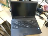 a laptop computer that is sitting on a desk