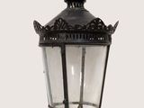 a black lamp with a crown on top of it