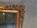 a mirror hanging on the wall in a room