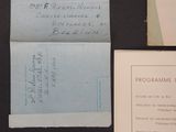 some old papers are sitting on a table next to a piece of paper