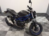 a picture of a motorcycle parked on a checkered floor