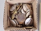 a box full of coins sitting on top of a table