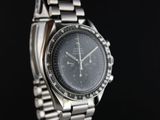 a close up of a watch on a black background