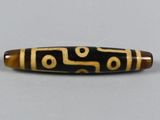 a close up of a pen on a table with a white background