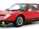 the red sports car is parked on a white surface