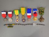 many medals and a knife on the table