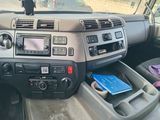 a car dashboard with a book in the middle of it