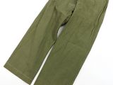 a close up of a pair of green pants on a white surface