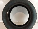 a close up of a tire on a white surface
